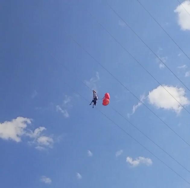'Heart-Stopping Moment: Zipline Adventurer Stranded 150 Feet in the Air as High Winds Halt Her Ride'