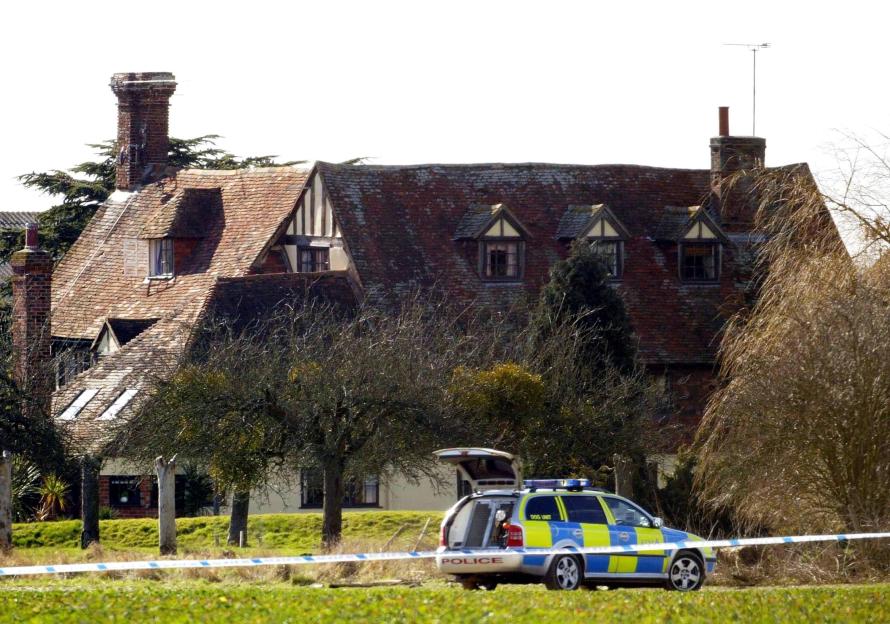 A police car at Elderden Farm, Staplehurst, Kent, during the search for the gang behind the £53 million Securitas depot robbery.