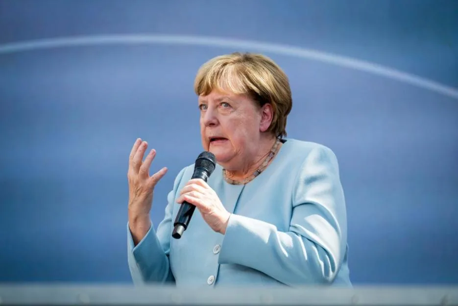 Former Chancellor Angela Merkel speaking onstage.