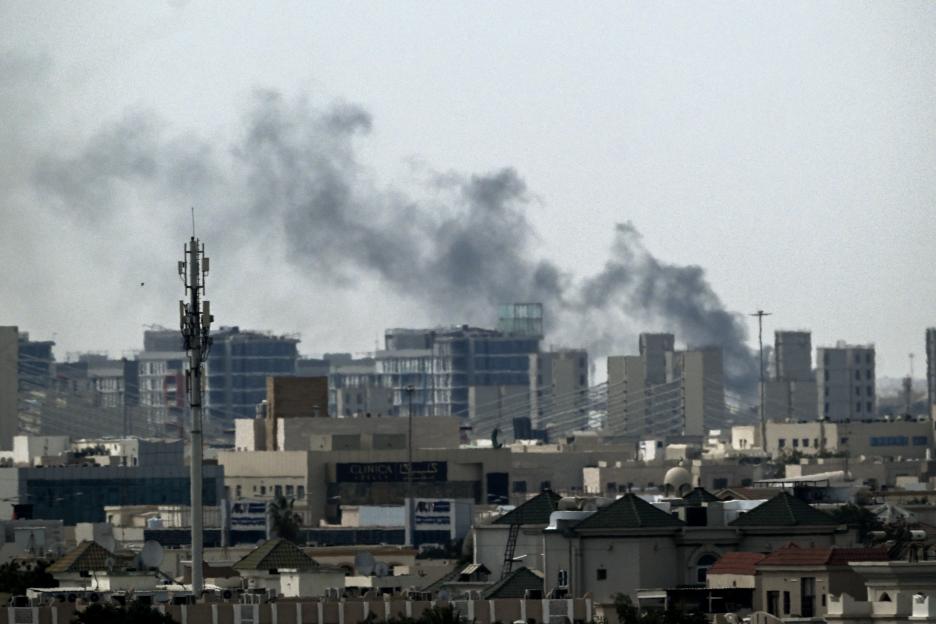 Plumes of smoke rising over buildings in Doha.