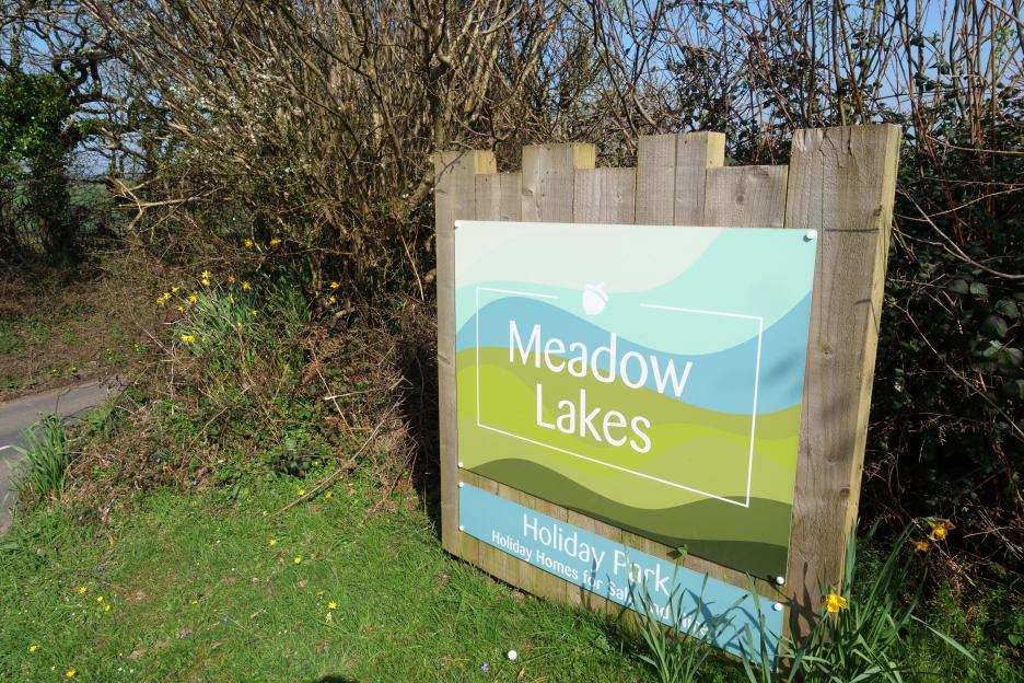 Sign for Meadow Lakes Holiday Park.