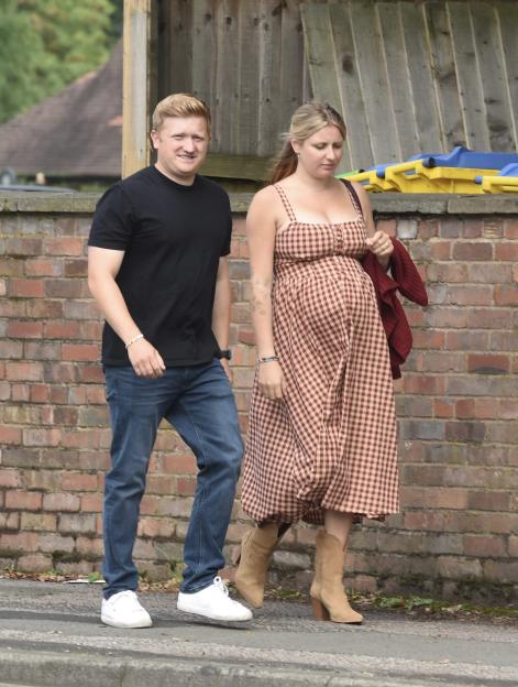 Sam Aston and his wife Briony Gardner arriving at the Mum&Me event, with Briony displaying her baby bump.