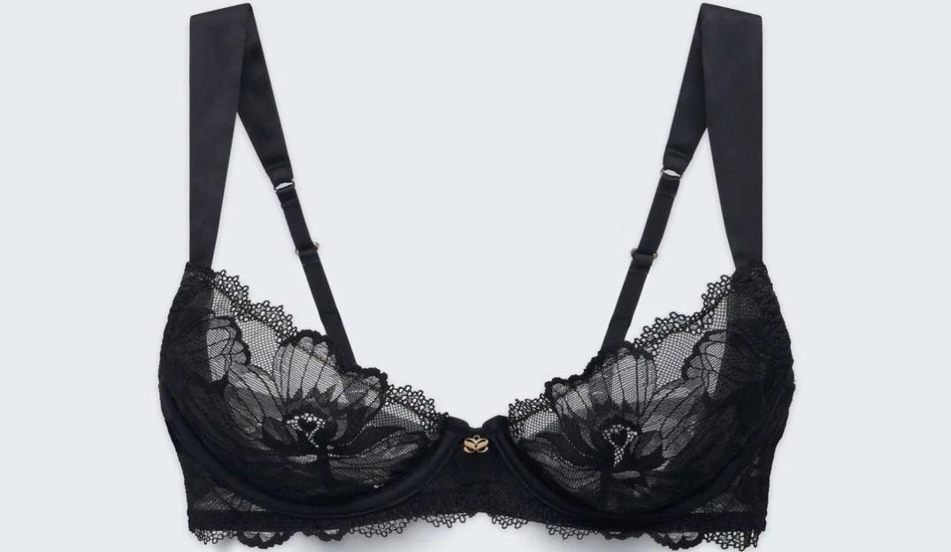 Black lace plunge bra with a gold-colored accent between the cups.