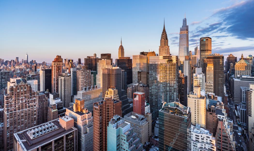 Sunrise skyline view of Midtown Manhattan and Lower Manhattan.