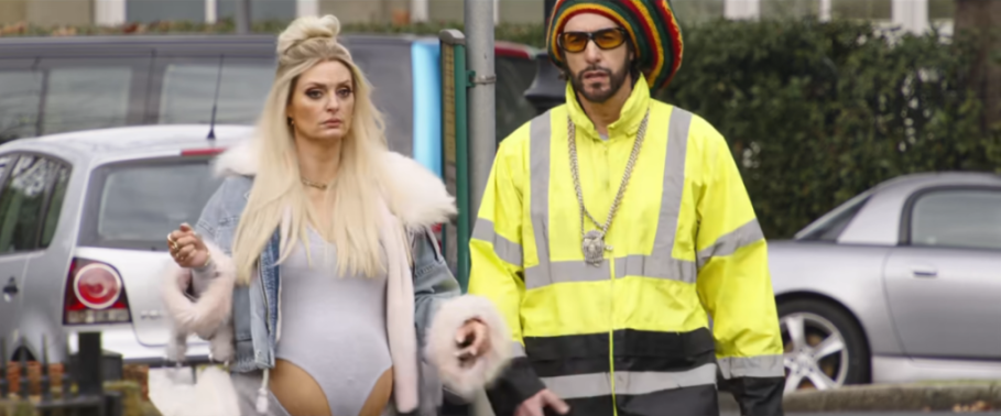 A blonde woman in a jean jacket and a man in a yellow high-visibility jacket with a red, yellow, and green beanie.