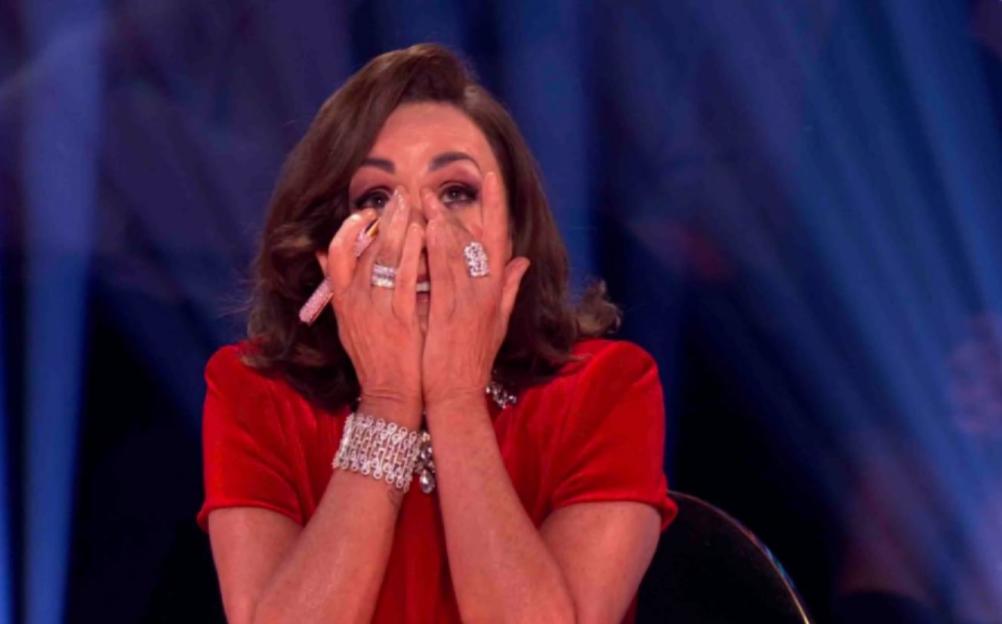 Shirley Ballas covers her face with her hands, appearing distraught.