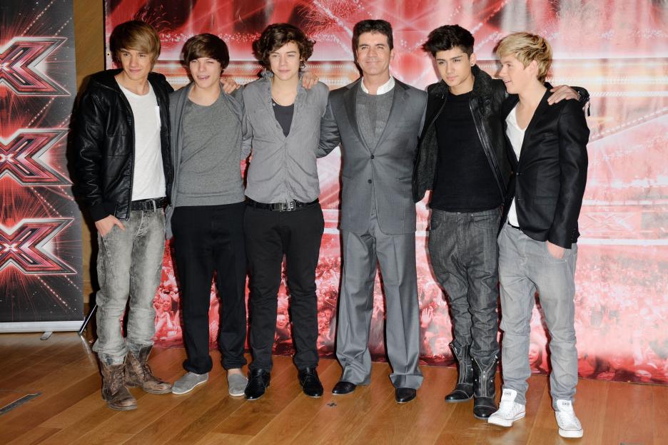 Simon Cowell and One Direction attends an X-Factor photocall, The Connaught, London, 9th December 2010.