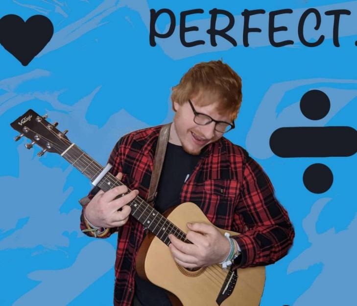 Man who looks like Ed Sheeran playing a guitar with "PERFECT." and a division sign in the background.