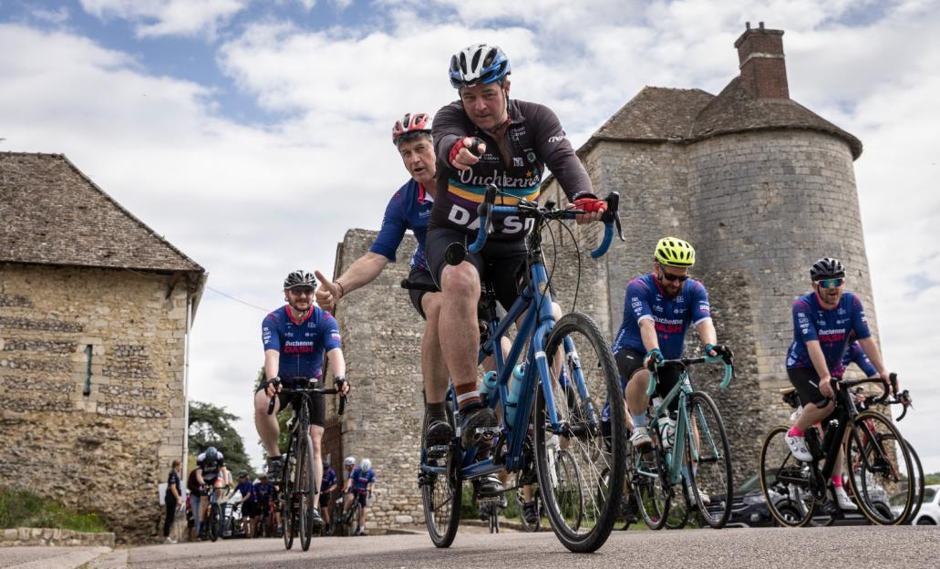 Liam Halligan, new boyfriend of Kate Garraway, cycling with other people on a Duchenne Dash event.