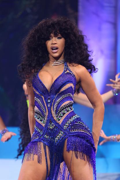 Cardi B performing onstage in a blue beaded outfit at the 2023 MTV Video Music Awards.