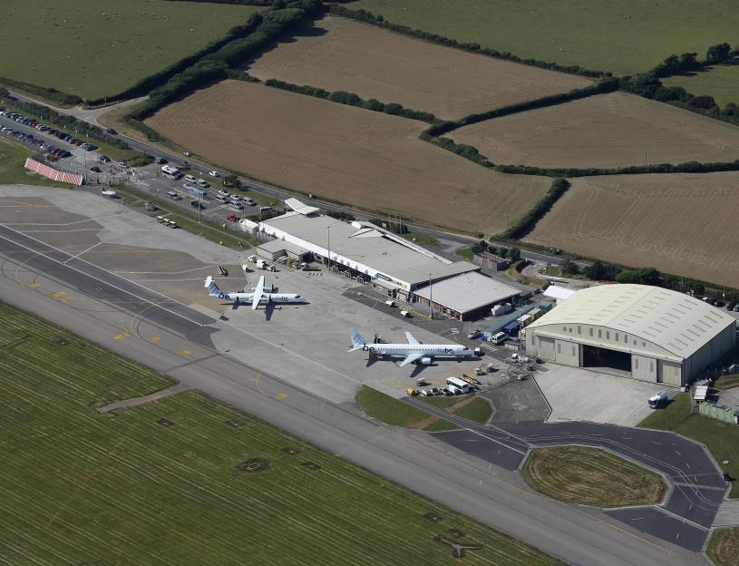 Aerial view of the Newquay (Cornwall) airport terminal with two Flybe aircraft on the ramp.