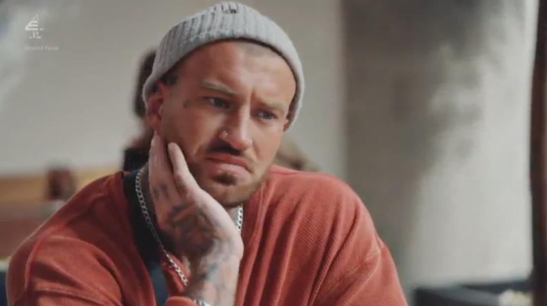 Joe from MAFS looking upset while holding his face.