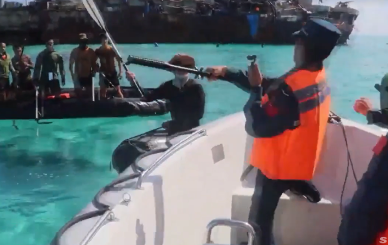 Members of the Chinese Coast Guard and Philippine Navy clash with oars and sticks near the LST-542-class tank landing ship BRP Sierra Madre (LT-57), which was purposefully beached in 1999 on the di...