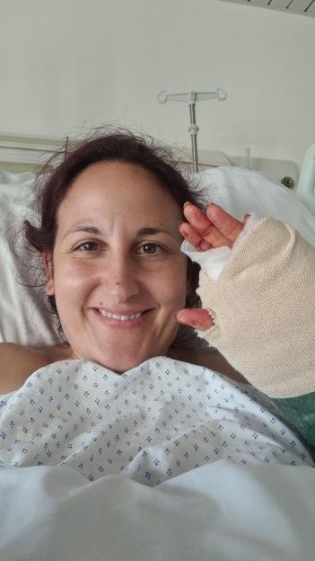 Annie Perez in hospital with a bandaged hand after suffering severe burns from an epileptic seizure in a hot shower.