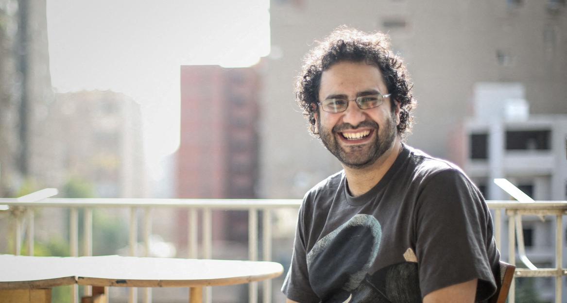 Egyptian-British hunger striker Alaa Abd el-Fattah smiles and looks at the camera.