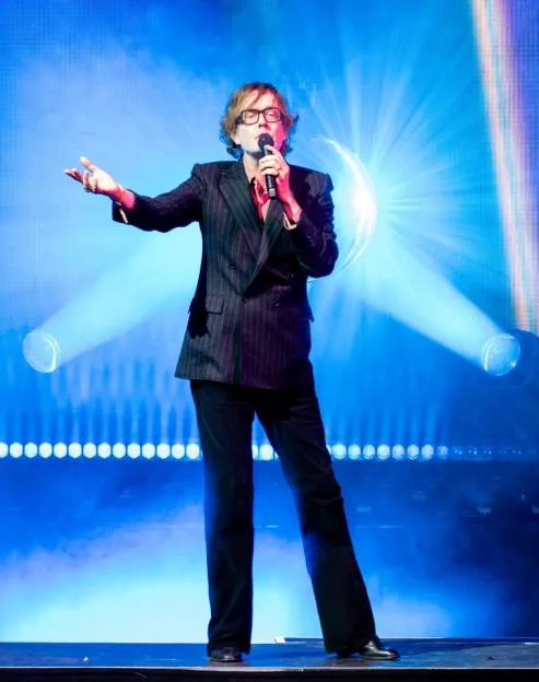 Jarvis Cocker performs on stage at Wythenshawe Park.
