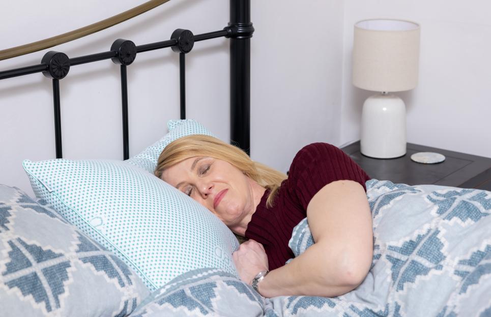 Woman sleeping on a CBD pillow.