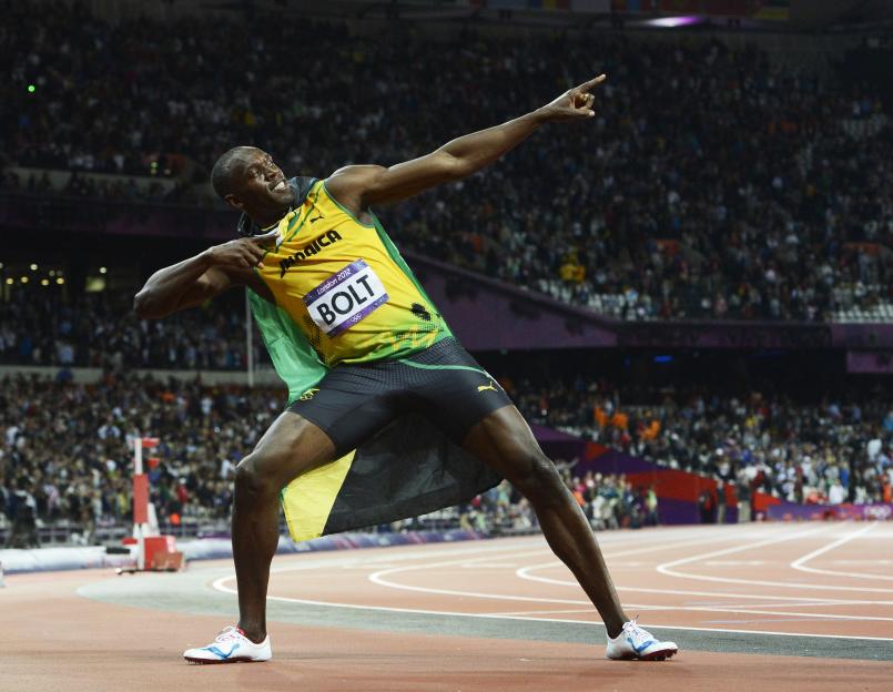 Usain Bolt celebrates winning the men's 100m final at the London 2012 Olympic Games.
