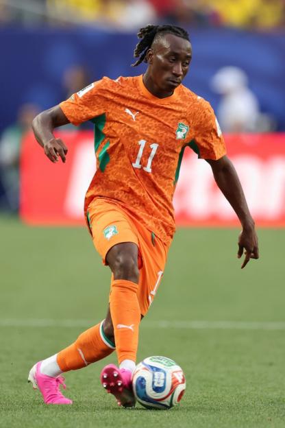 Cote d'Ivoire player Simon Adingra dribbles the ball during a FIFA World Cup 2026 match.