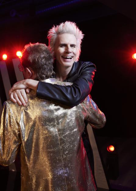 John Taylor and Simon Le Bon of Duran Duran embracing.