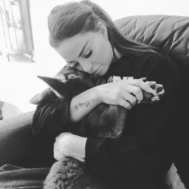 Katie Price embracing her dog Sparkle.