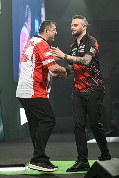 'Darts Star Takes a Cheeky Shot at Rival Amid 'Cheat' Controversy'