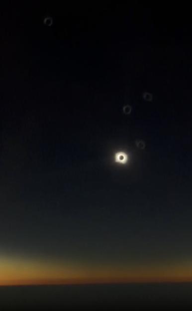 "British Flight to Spain Captures Breathtaking Solar Eclipse as Pilot Cautions Passengers Against Glancing Up"