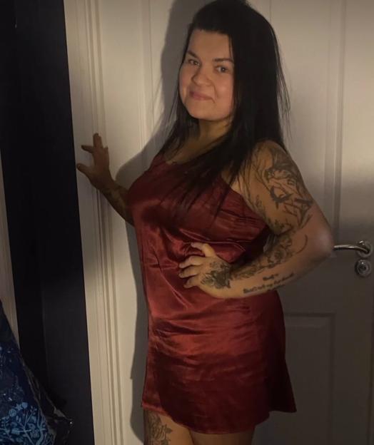 Stacey Victoria Simpson in a red nightgown.