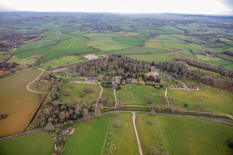Aerial view of The Newt estate in Somerset, England, showing its historic buildings, gardens, and surrounding farmland.