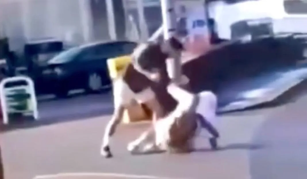 CCTV still showing former world boxing champion Joe Cordina and another man in a physical altercation outside a petrol station.