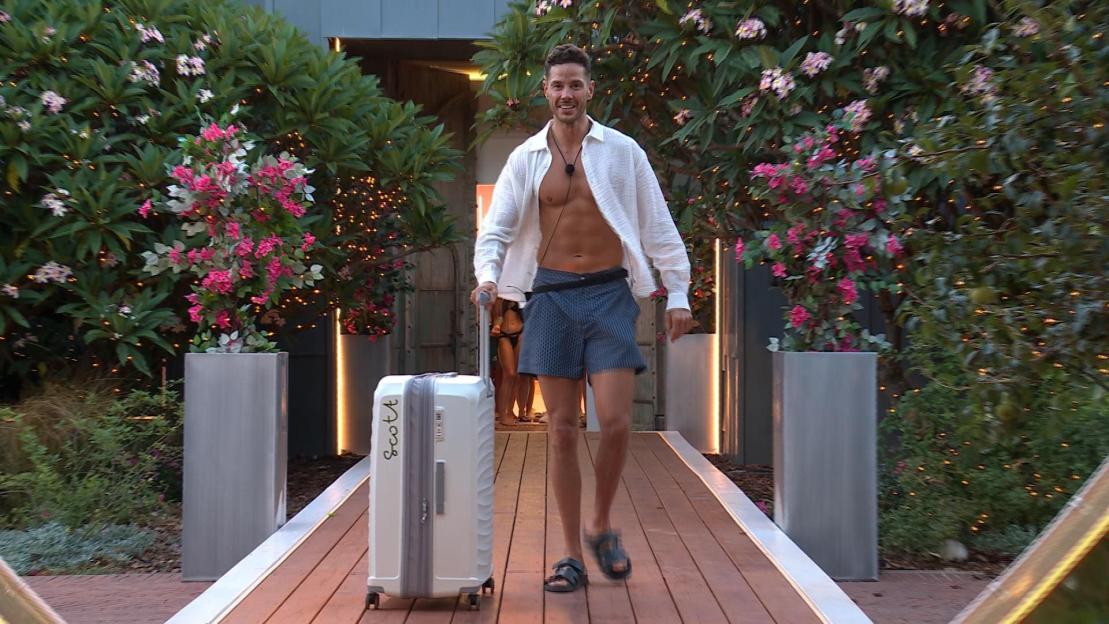 Scott Thomas arriving at the 'Love Island: All Stars' villa with his suitcase.