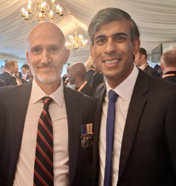 Darren Abramson with a woman and Rishi Sunak.