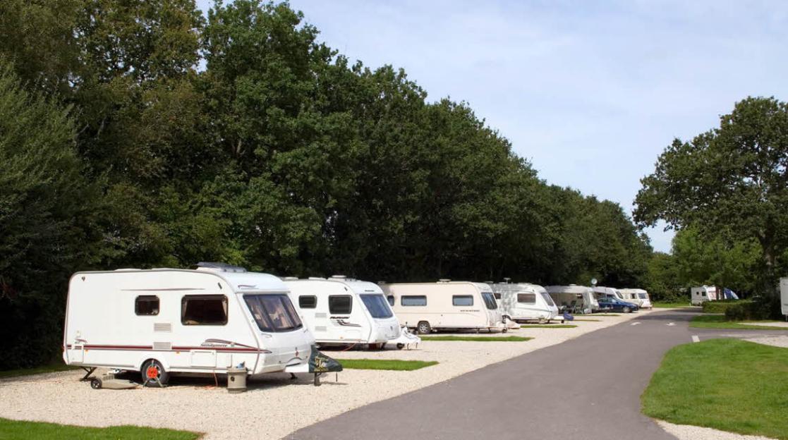 Caravans parked at Hunter's Moon Club Campsite, Cold Harbour, Wareham, Dorset.