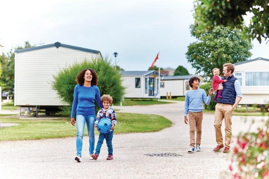 Family walking at Summerfields Holiday Park.