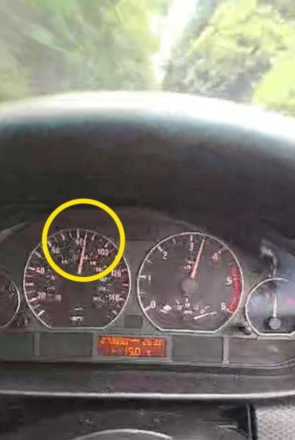 A car's speedometer shows the needle above 80 mph.