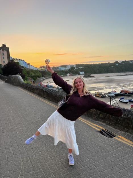 Emily Rose Browning standing in a Christmas tree field.