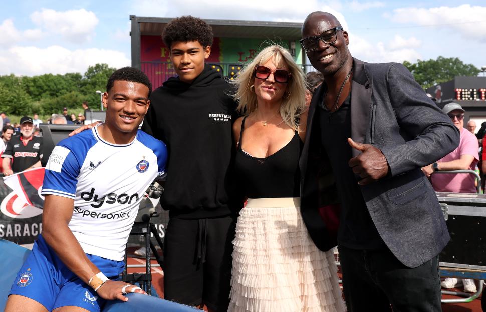 Tyler Offiah, his brother Phoenix, their mother Virginia, and father Martin Offiah pose together.