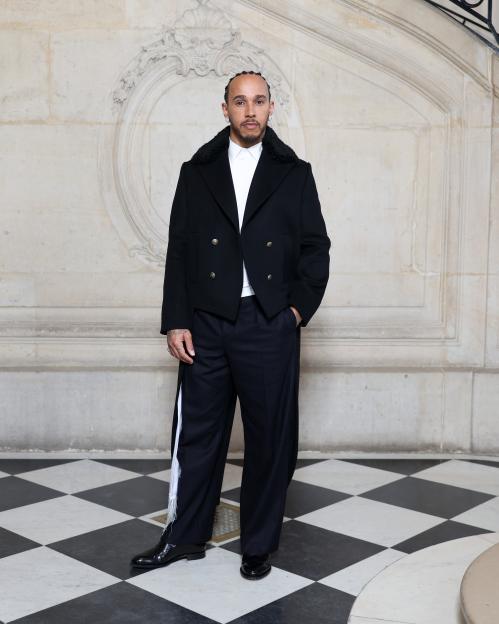 Lewis Hamilton in a black jacket and wide-leg trousers at the Dior Homme Fall/Winter 2026-2027 show.