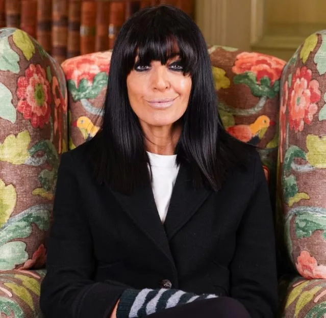 Why does Claudia Winkleman wear gloves on Celebrity Traitors?