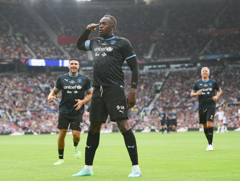 Usain Bolt celebrates scoring the first goal for World XI during the Soccer Aid for UNICEF 2023 match.