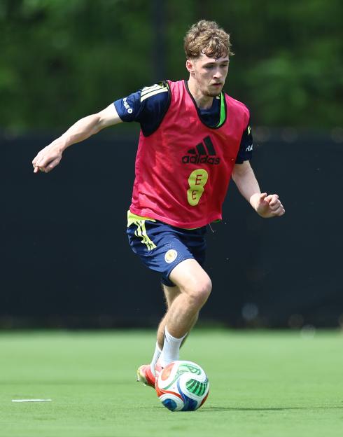 Tyler Fletcher of Scotland training with a football.