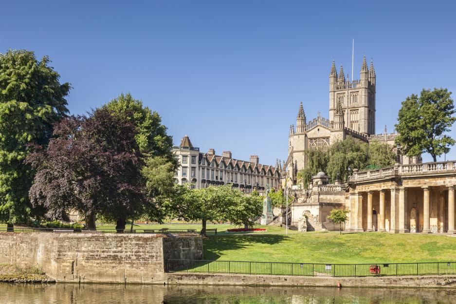Bath Abbey and the Orangerie on the banks of the River Avon in England.