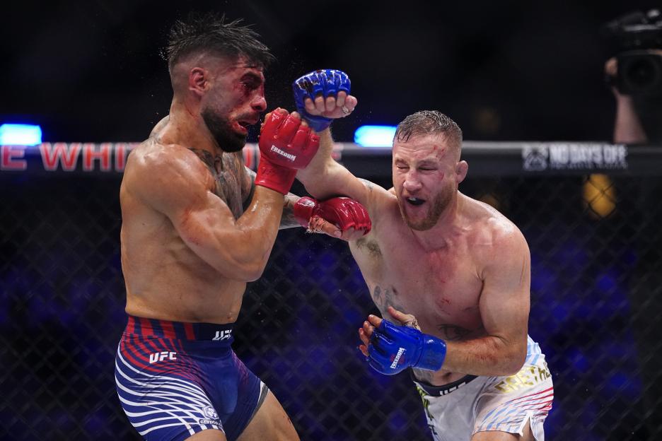 Justin Gaethje strikes Ilia Topuria in the UFC lightweight championship fight.