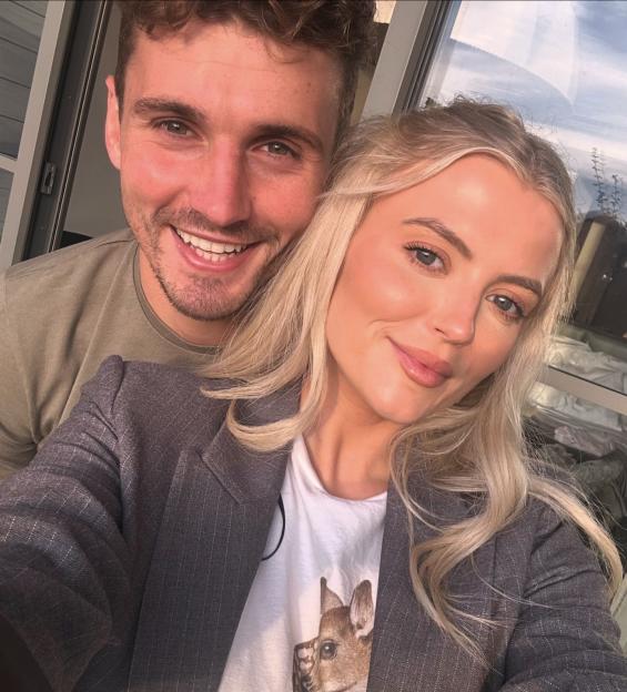 Coronation Street star Lucy Fallon and her boyfriend smiling at the camera.