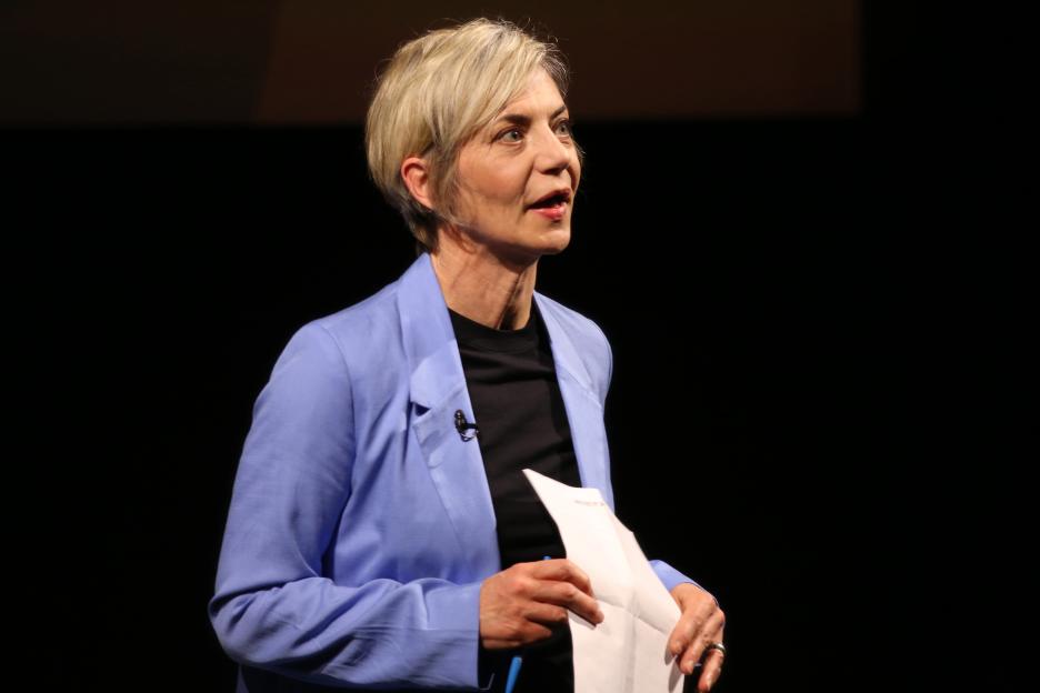 Host Miranda Sawyer speaking onstage.