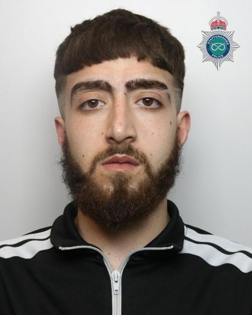 Mugshot of Daniel Mohammed with a Staffordshire Police emblem.