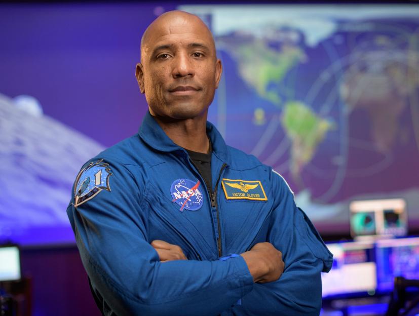 NASA astronaut Victor Glover poses in the Blue Flight Control Room at Johnson Space Center.