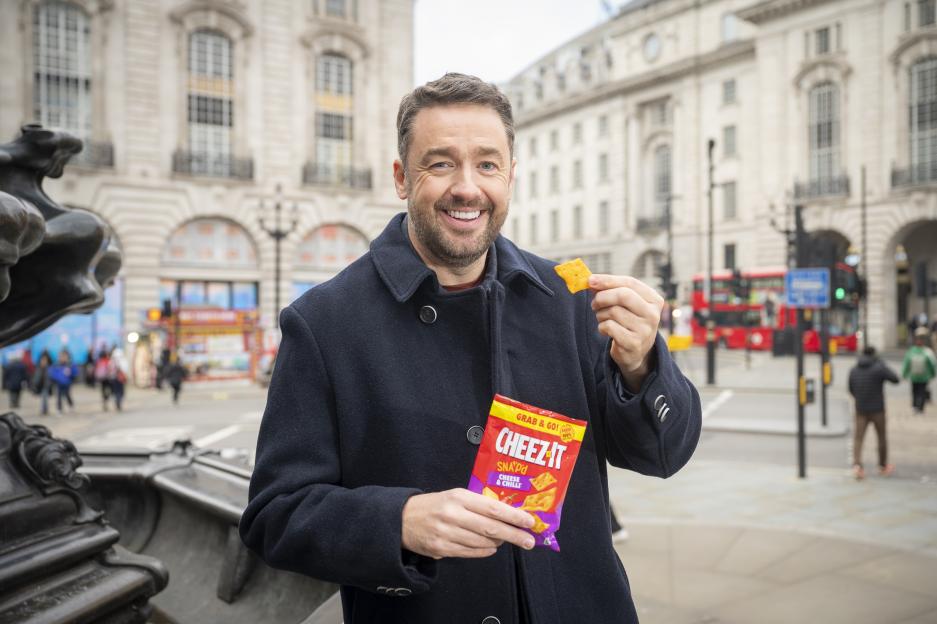 Jason Manford holds a Cheez-It cracker and a bag of Cheez-It Snap'd in London.