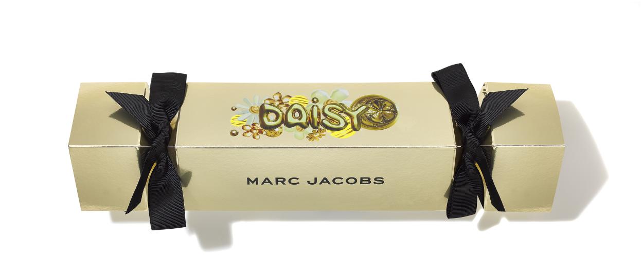 Marc Jacobs Daisy Christmas cracker gift box with black ribbon ties.