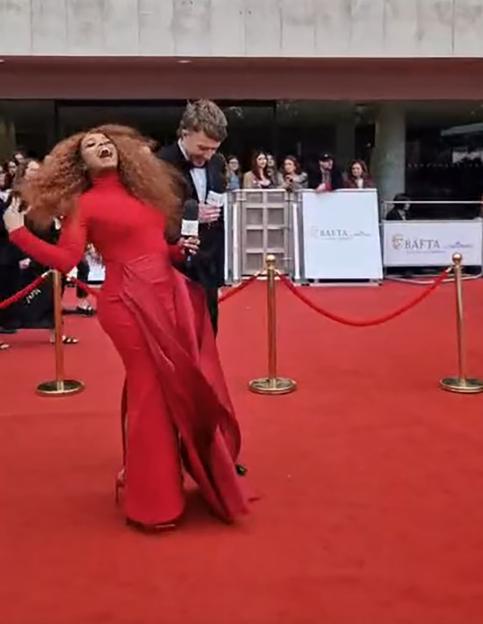 Fleur East Braves Howling Winds on the BAFTAs Red Carpet as Blustery Conditions Disrupt Broadcast